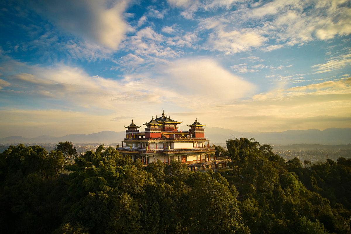 Kopan Monastery rising in the Nepalese Himalayan landscape, the living craft tradition behind every Serene Streams Tibetan singing bowl
